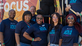 People wearing sunglasses and glasses smiling